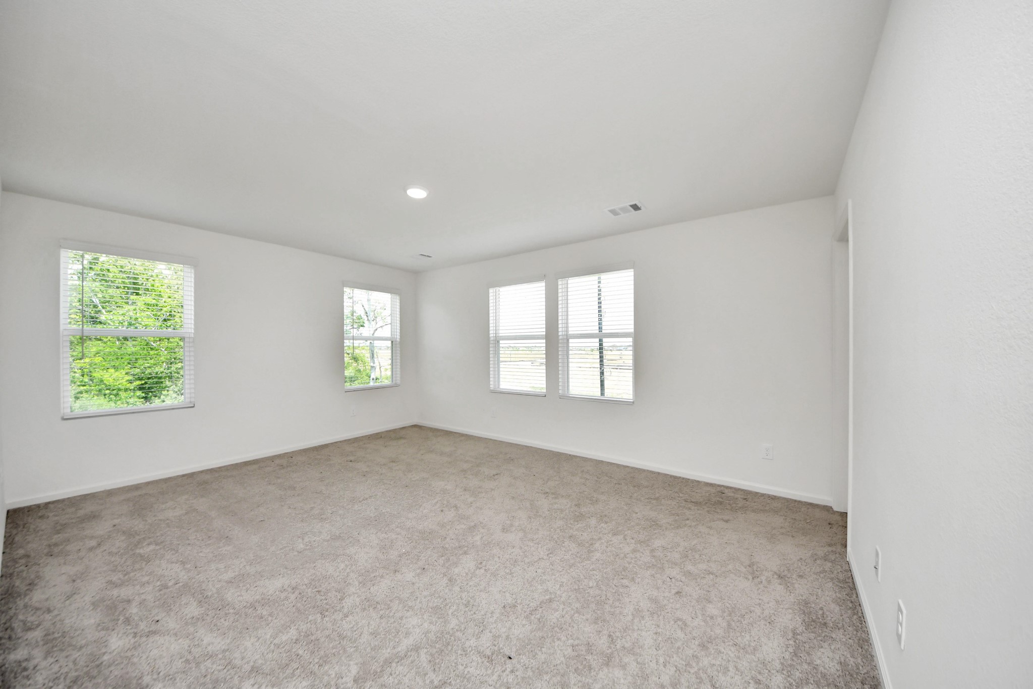 10303 Rose Mar Drive, Unit B Rosharon, TX 77583 - Photo 18 of 49 an empty room with windows