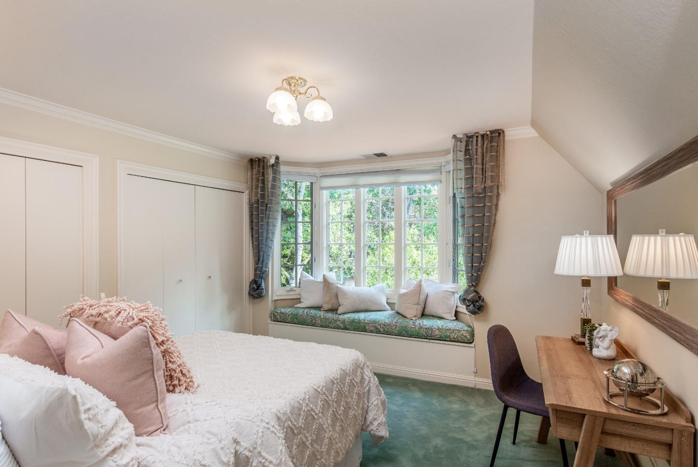 165 Farm Road Woodside, CA 94062 - Photo 17 of 29 a bedroom with a bed and a chandelier