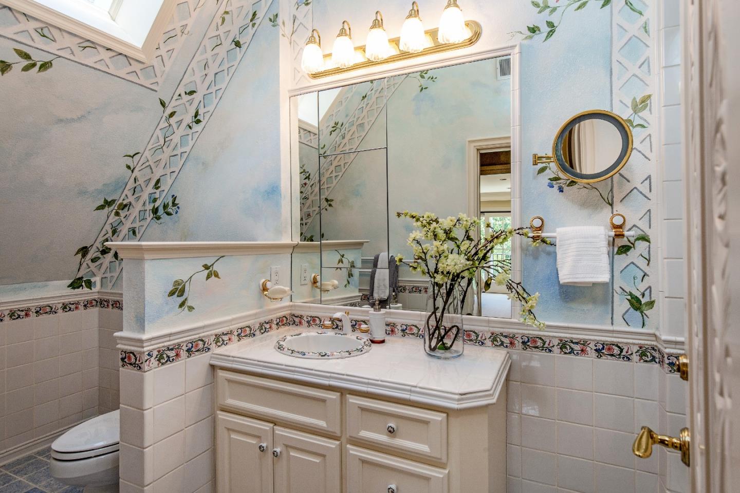 165 Farm Road Woodside, CA 94062 - Photo 18 of 29 a bathroom with a sink a toilet and mirror
