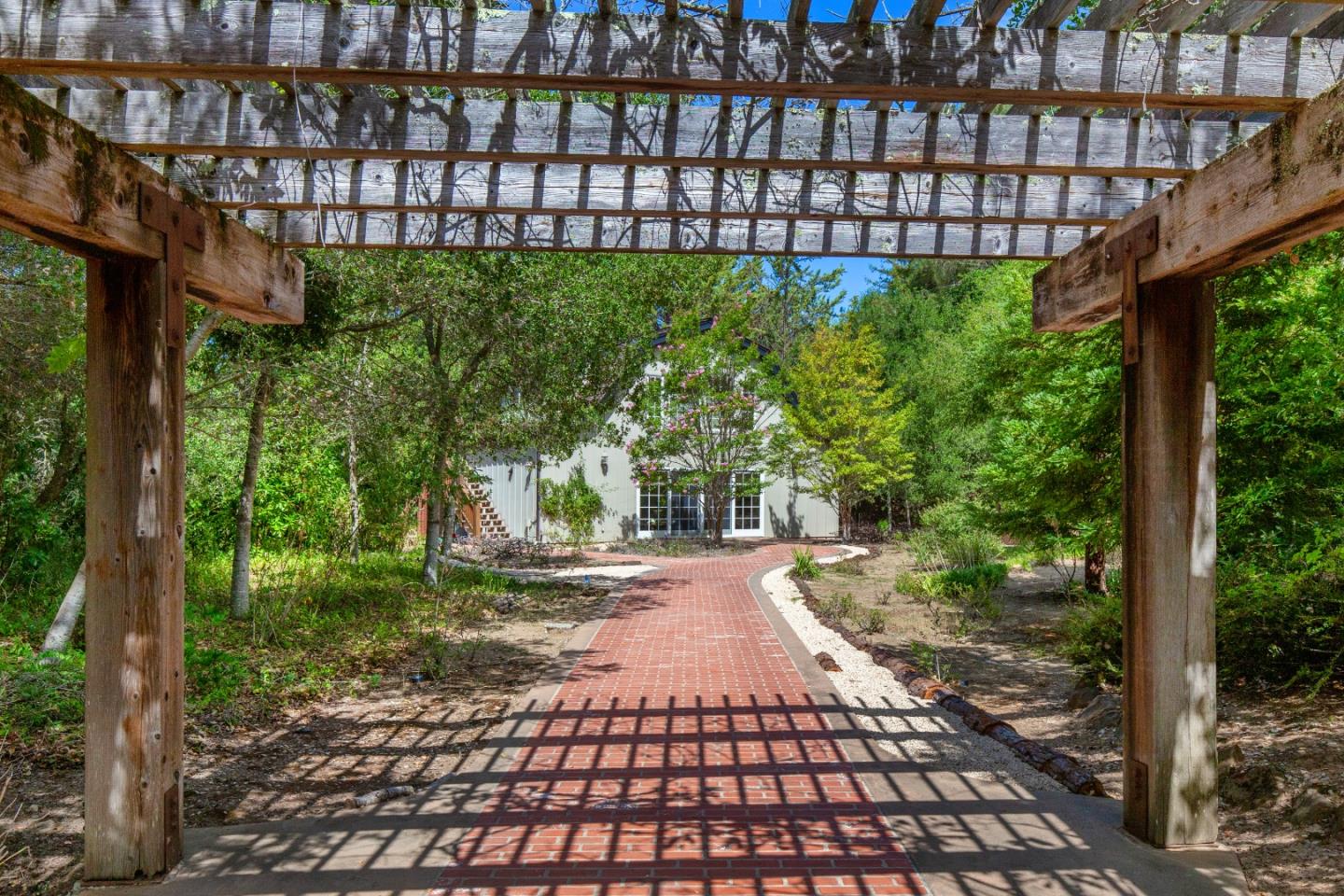 165 Farm Road Woodside, CA 94062 - Photo 23 of 29 a view of a pathway with a garden