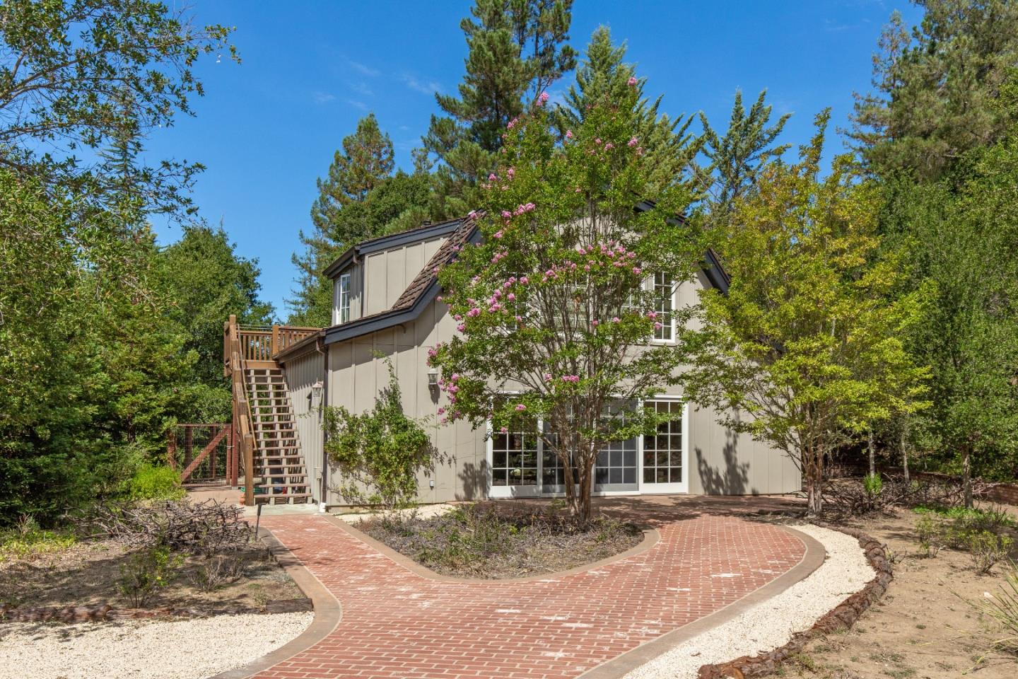165 Farm Road Woodside, CA 94062 - Photo 24 of 29 a view of a house with a tree in the background
