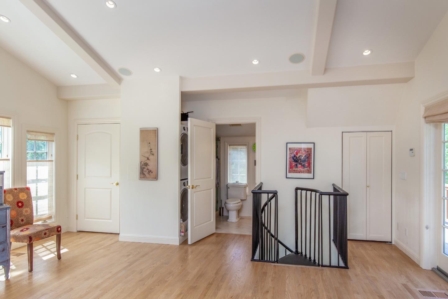 165 Farm Road Woodside, CA 94062 - Photo 28 of 29 a view of a hallway with wooden floor and stairs