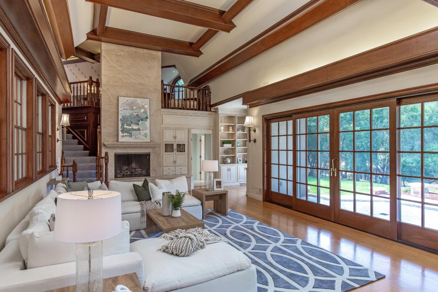 165 Farm Road Woodside, CA 94062 - Photo 5 of 29 a living room with furniture large window and a fireplace