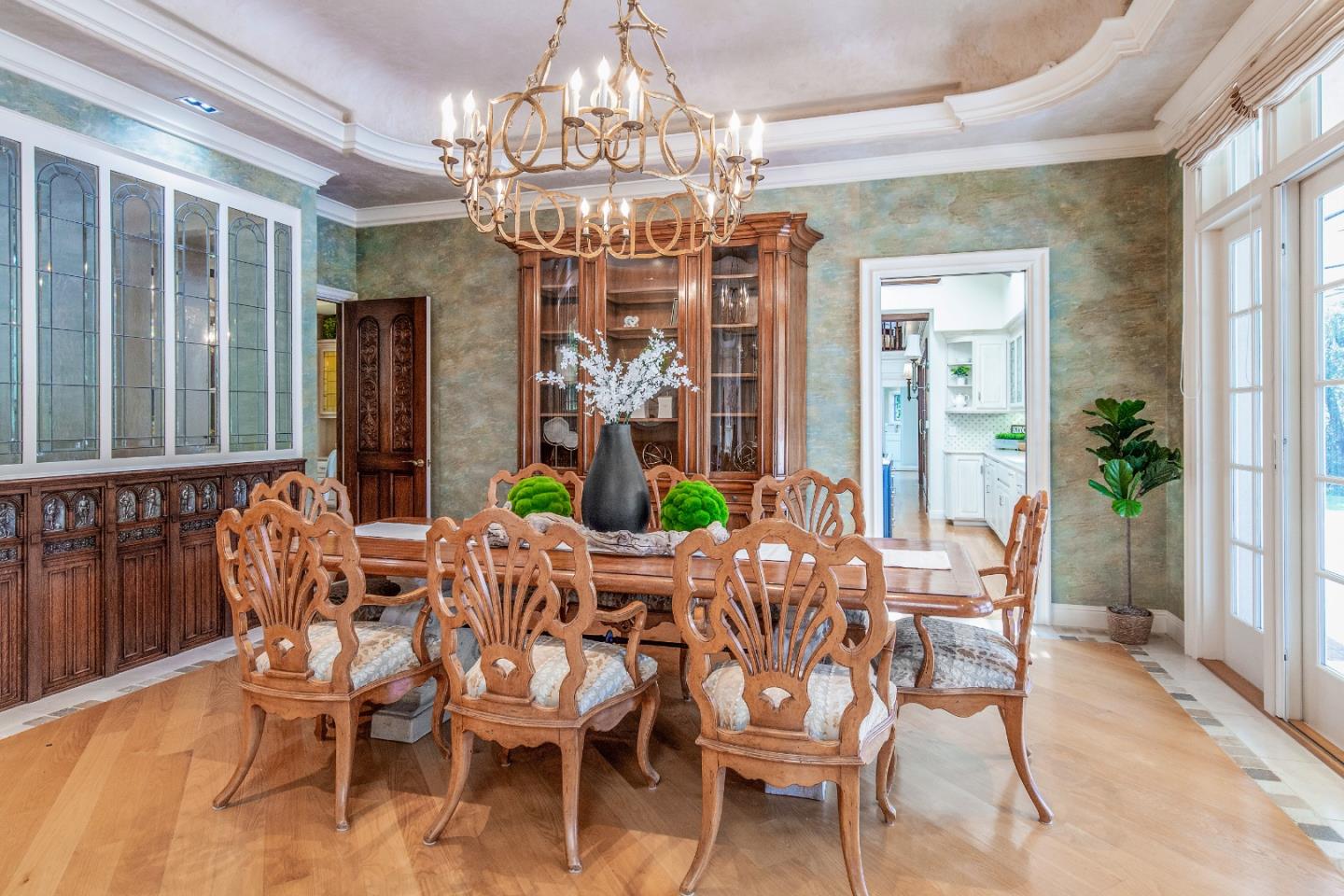 165 Farm Road Woodside, CA 94062 - Photo 9 of 29 a view of a dining room with furniture a chandelier and wooden floor