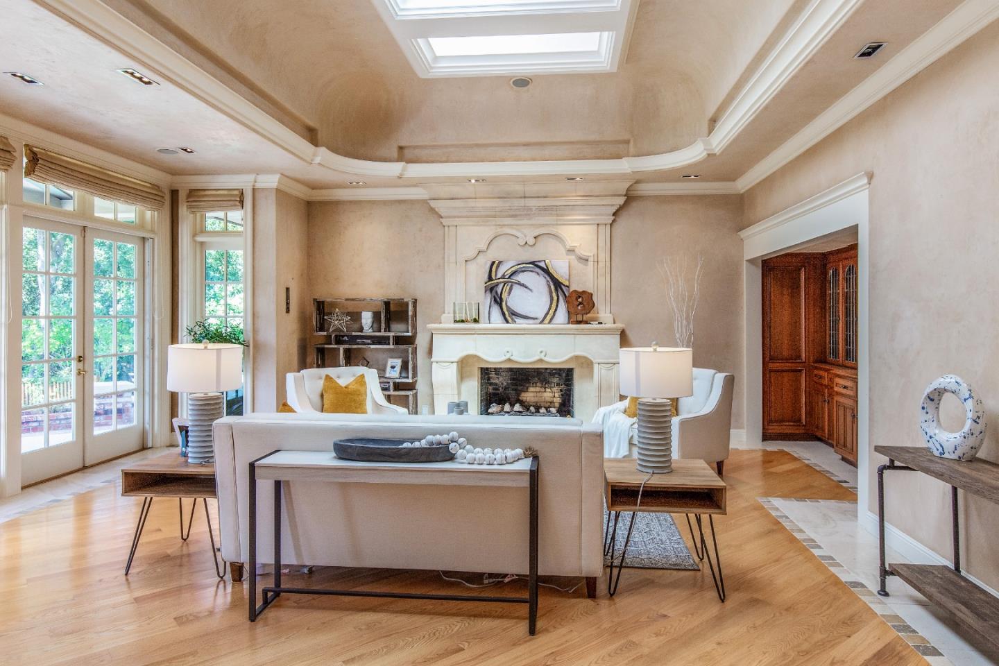 165 Farm Road Woodside, CA 94062 - Photo 10 of 29 a living room with furniture a fireplace and a dining table with wooden floor
