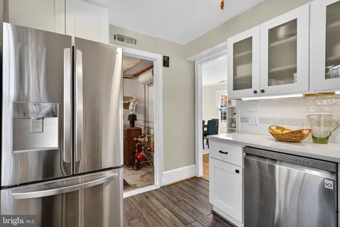 a kitchen with stainless steel appliances a refrigerator and a sink