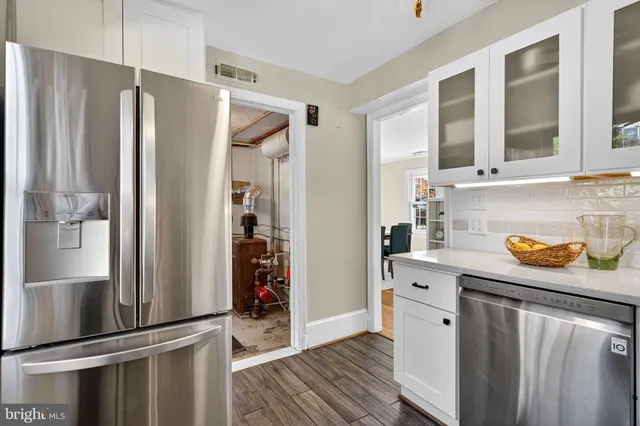 a kitchen with stainless steel appliances a refrigerator and a sink