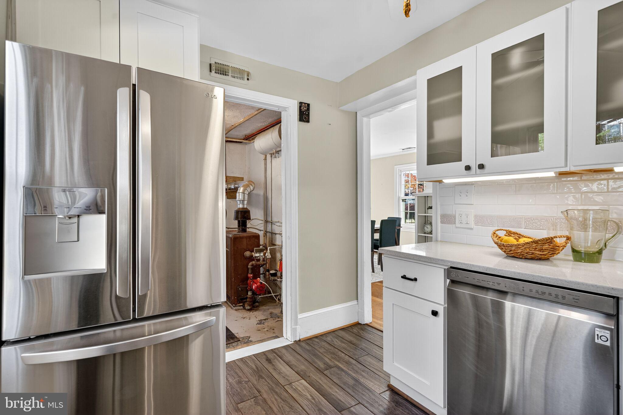 315 Ladson Road Silver Spring, MD 20901 - Photo 11 of 26 a kitchen with stainless steel appliances a refrigerator and a sink