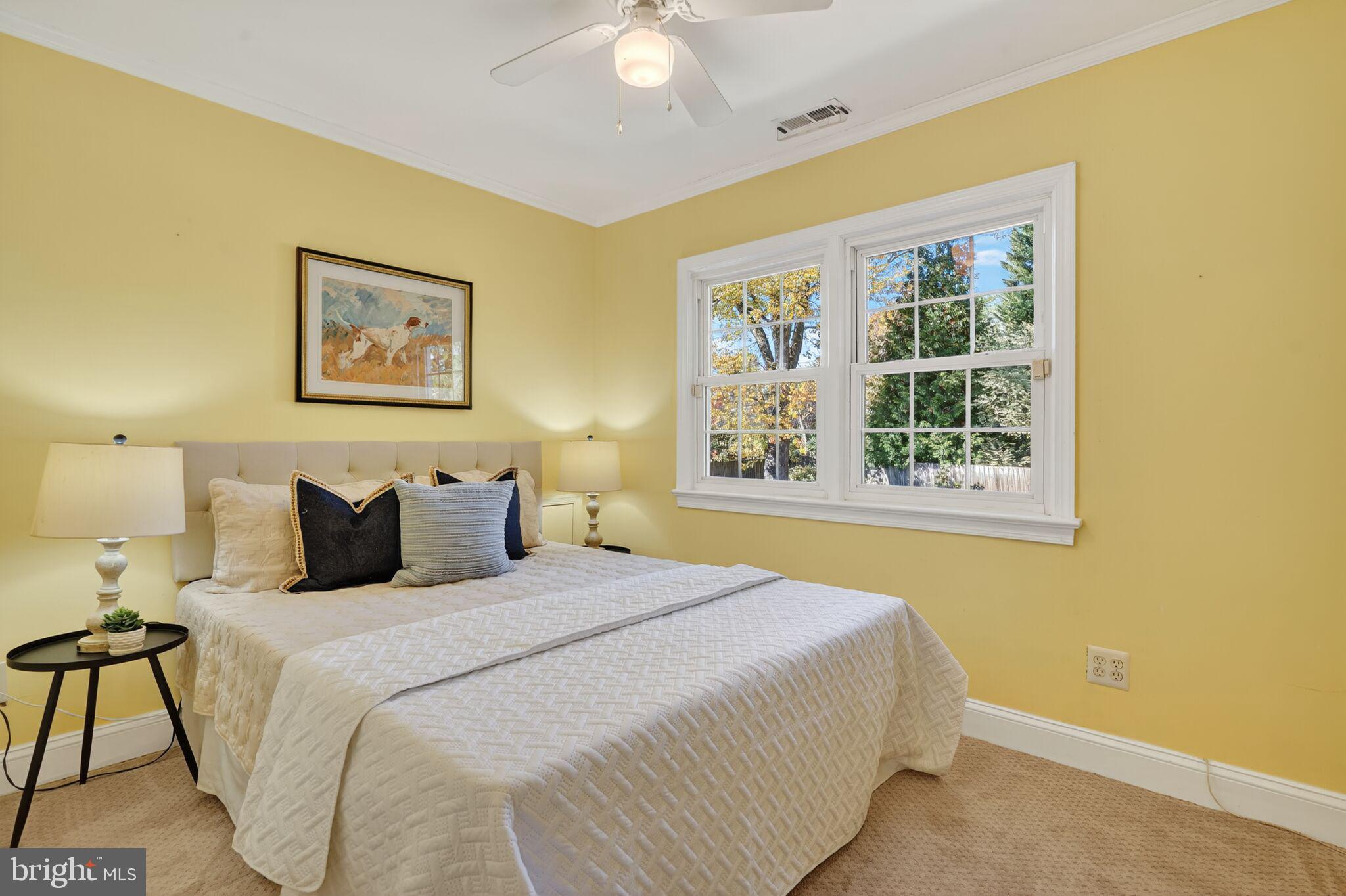 315 Ladson Road Silver Spring, MD 20901 - Photo 16 of 26 a bedroom with a bed and a painting on the wall
