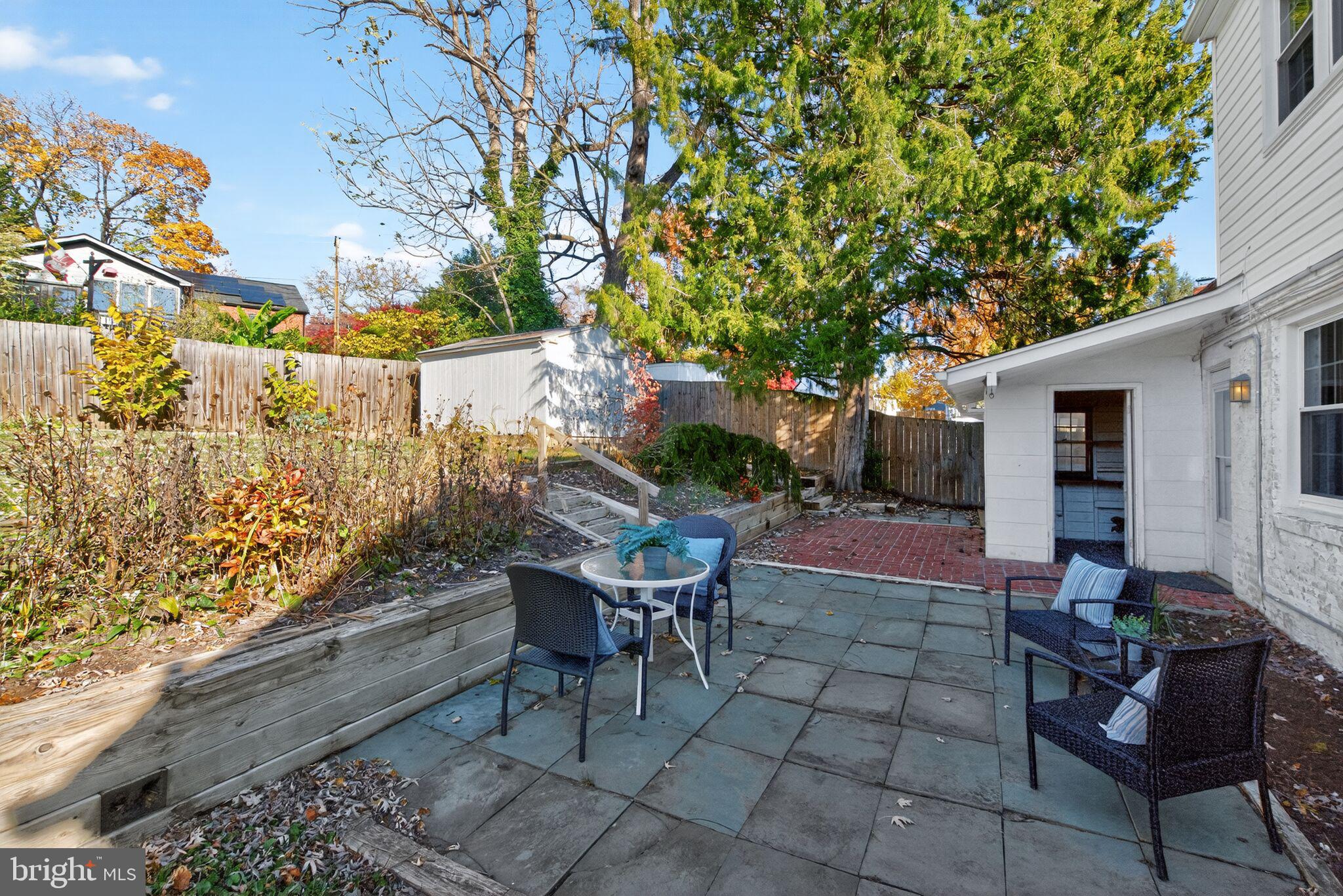 315 Ladson Road Silver Spring, MD 20901 - Photo 24 of 26 a backyard of a house with table and chairs
