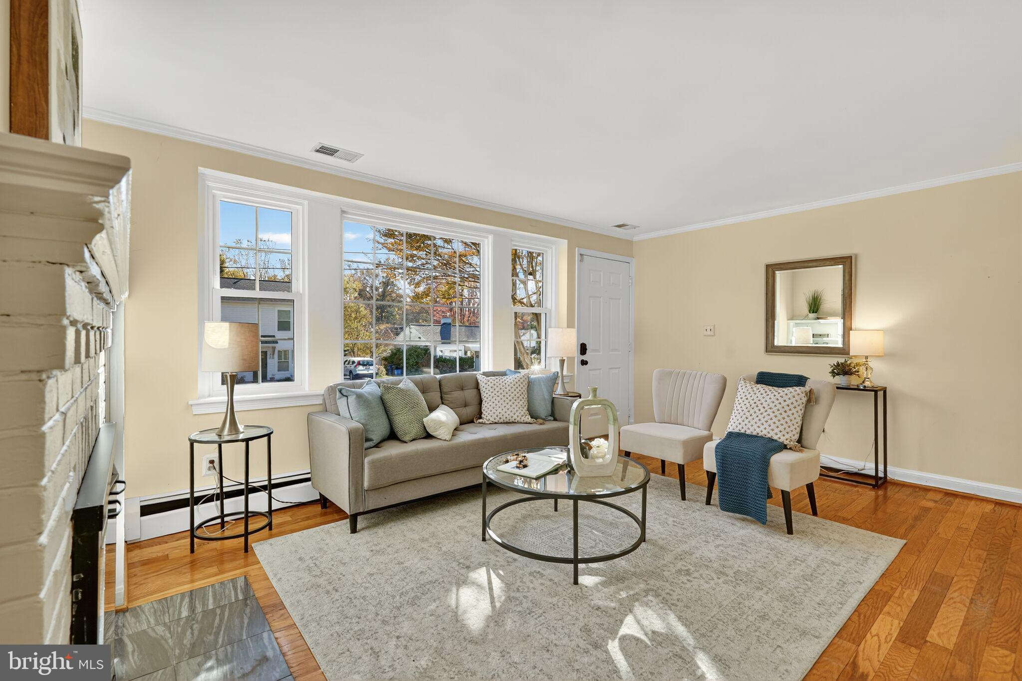 315 Ladson Road Silver Spring, MD 20901 - Photo 7 of 26 a living room with furniture and a large window