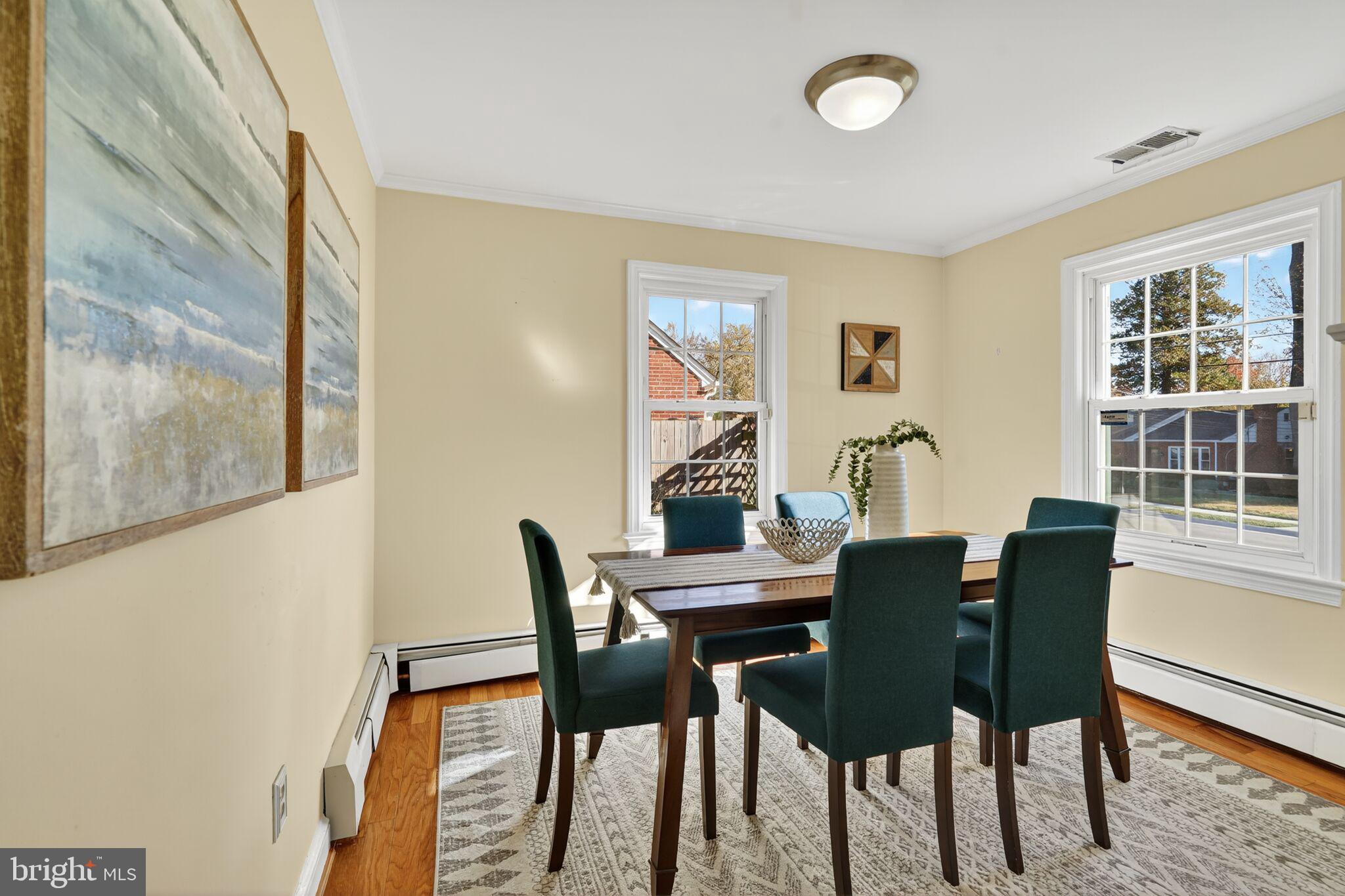 315 Ladson Road Silver Spring, MD 20901 - Photo 8 of 26 a view of a dining room with furniture and a window