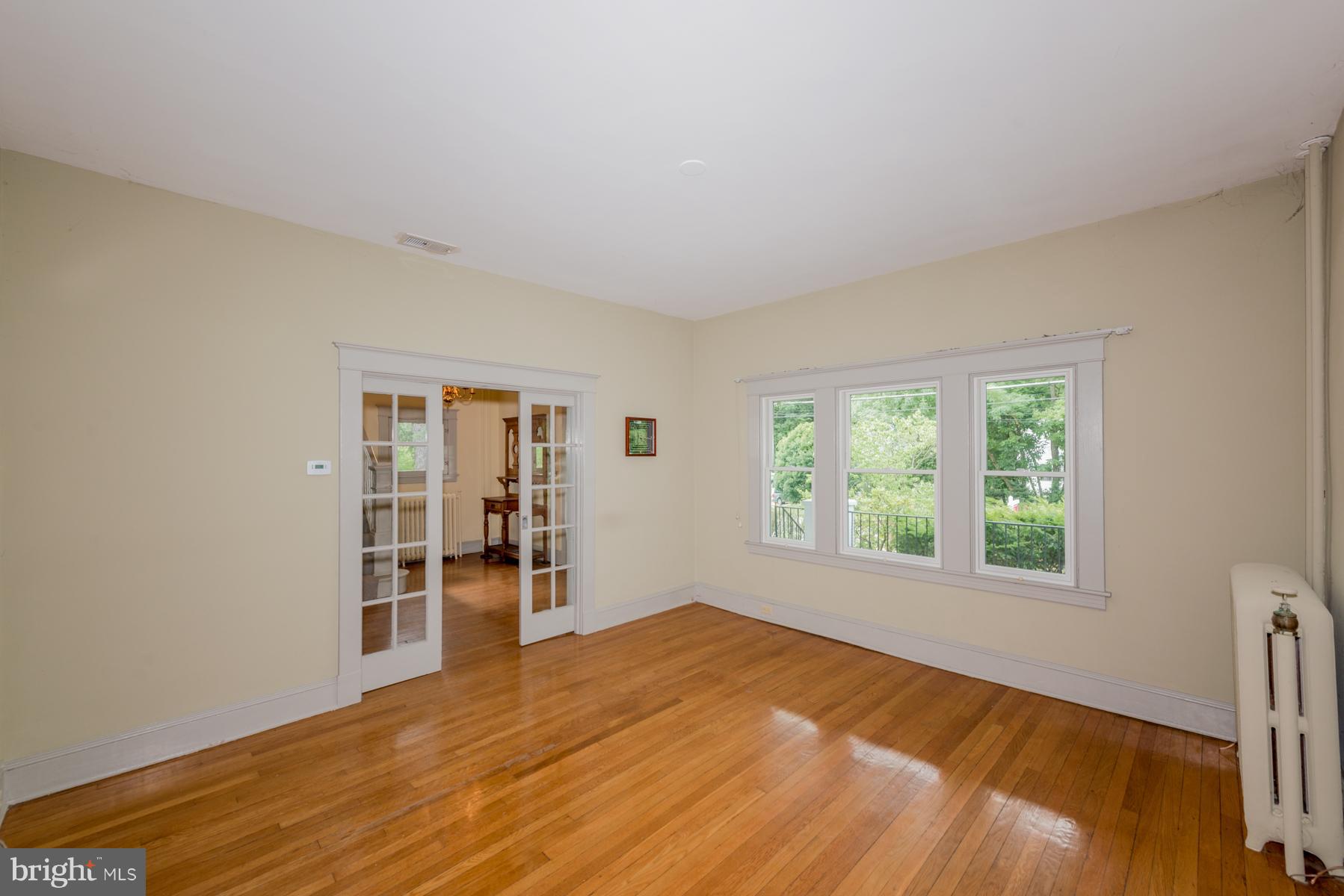 1701 Frederick Road Baltimore, MD 21228 - Photo 14 of 30 a view of empty room with wooden floor and fan