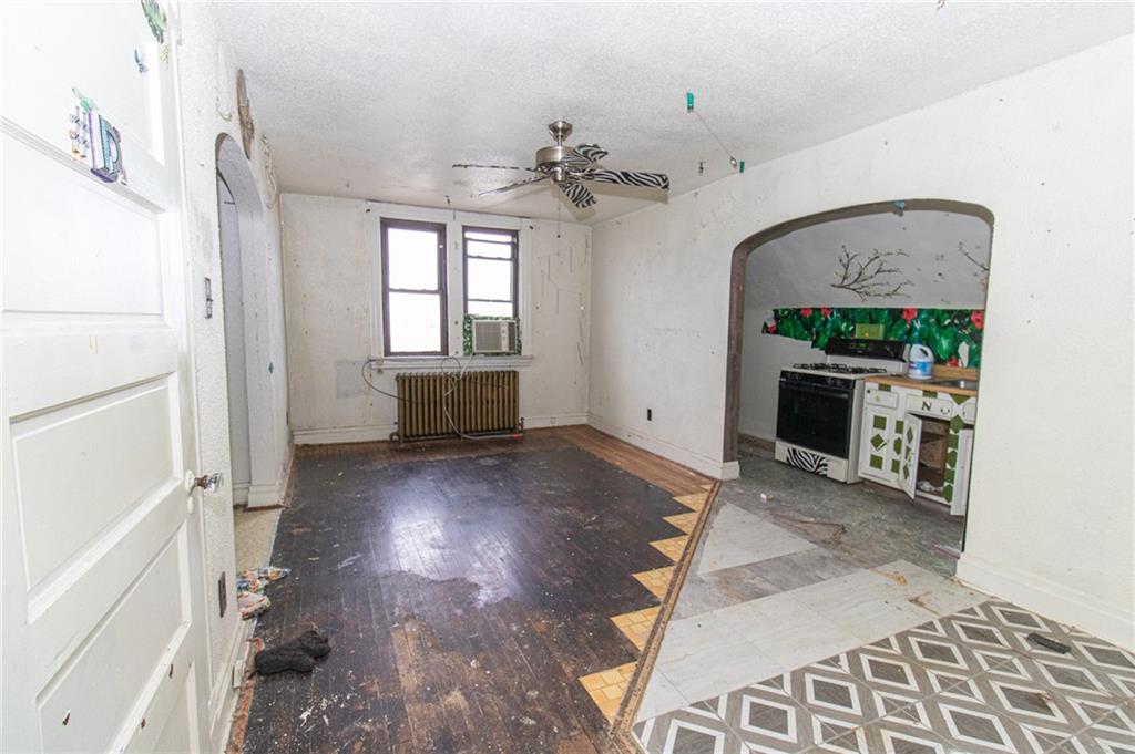 151 Margaret Street Pittsburgh, PA 15210 - Photo 26 of 36 wooden floor in an empty room with a window