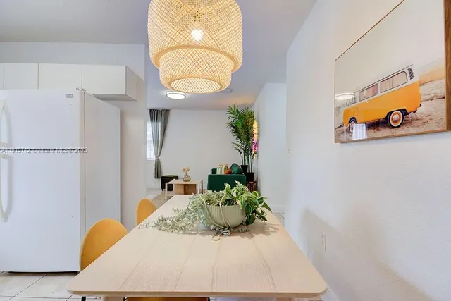 a view of a hallway with paintings on the wall