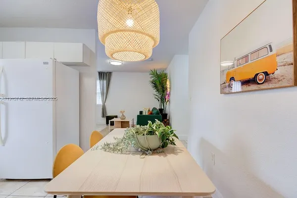a view of a hallway with paintings on the wall