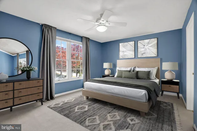 a spacious bedroom with a large bed and a window