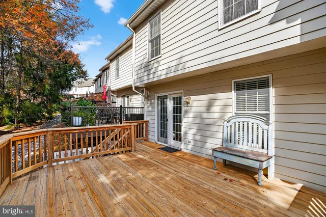 a view of a wooden deck with a bench