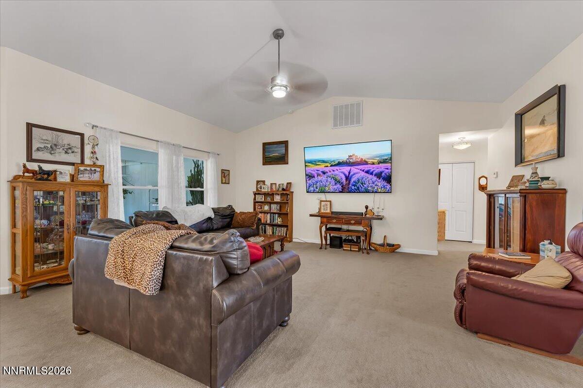 1197 Sky Ridge Drive Fallon, NV 89406 - Photo 8 of 79 a living room with furniture and a flat screen tv
