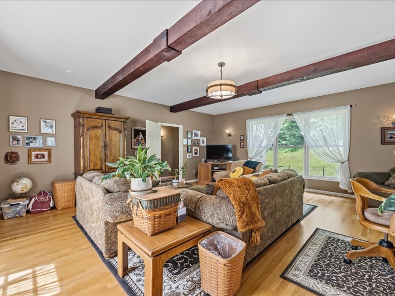 1168 Mt Pleasant Road Bangor, PA 18013 - Photo 64 of 100 Rich exposed ceiling beams and warm hardwood flooring define this comfortable main living space.