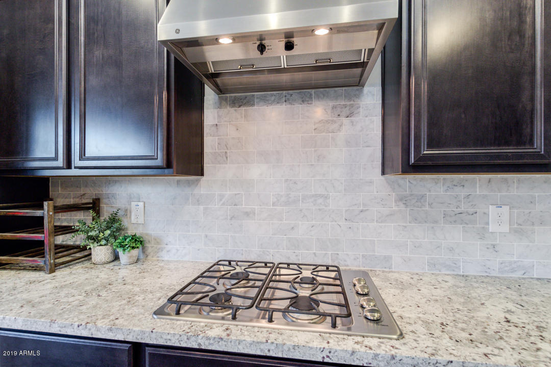 2665 East Stacey Road Gilbert, AZ 85298 - Photo 19 of 56 a kitchen with a stove and a microwave