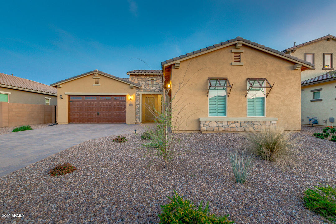 2665 East Stacey Road Gilbert, AZ 85298 - Photo 2 of 56 a front view of a house with a yard and garage