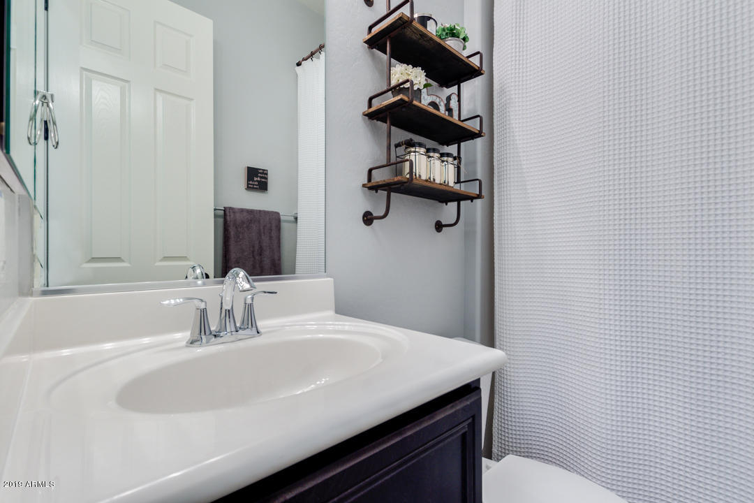 2665 East Stacey Road Gilbert, AZ 85298 - Photo 34 of 56 a bathroom with a sink and toilet