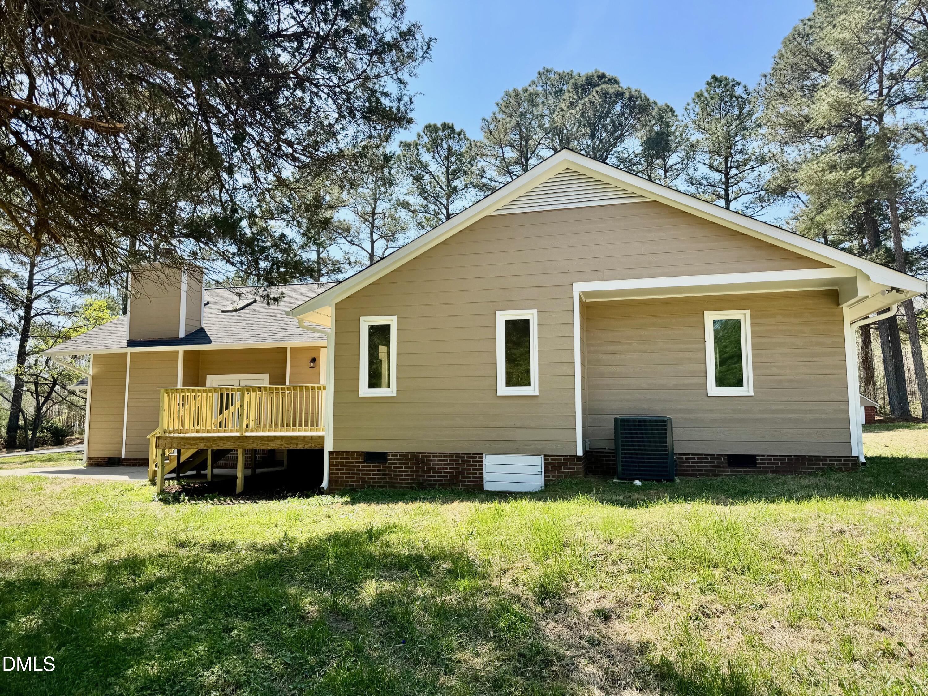 1720 Ross Mill Road Henderson, NC 27537 - Photo 5 of 42 a front view of a house with a yard