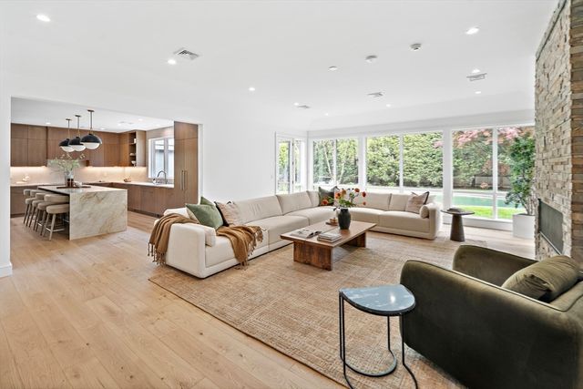 a bathroom with a double vanity sink toilet mirror and bathtub