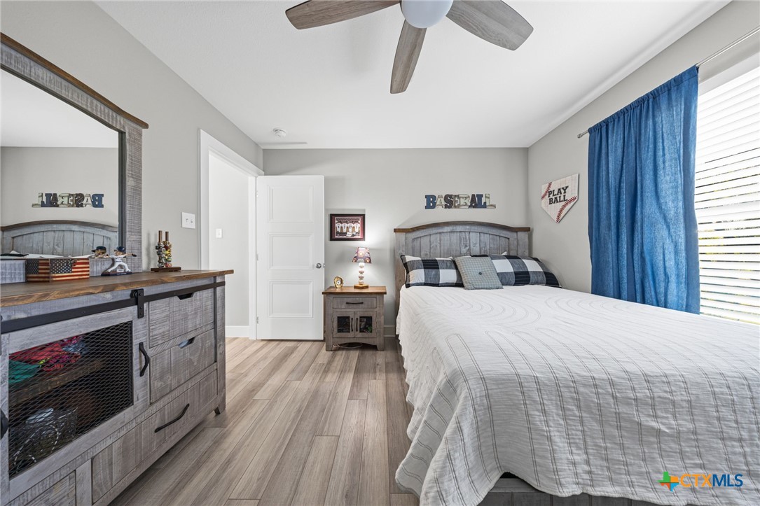 28099 Fm 2670 Killeen, TX 76549 - Photo 27 of 48 a bedroom with a bed and a fireplace