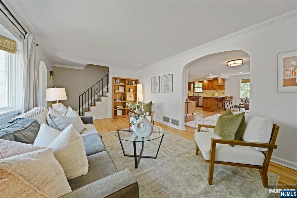 99 Ferncliff Road Bloomfield, NJ 07003 - Photo 3 of 30 a living room with furniture and a wooden floor