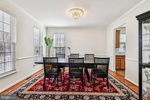 a large kitchen with stainless steel appliances granite countertop a sink and cabinets