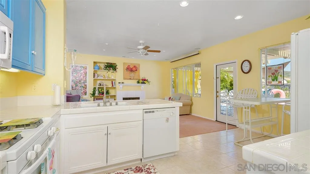 769 Avenida Codorniz San Marcos, CA 92069 - Photo 11 of 25 a view of a kitchen with stainless steel appliances granite countertop a sink and cabinets