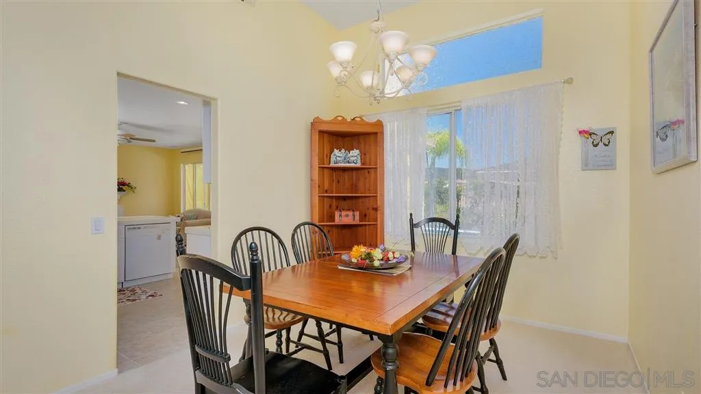 769 Avenida Codorniz San Marcos, CA 92069 - Photo 12 of 25 a view of a dining room with furniture and chandelier
