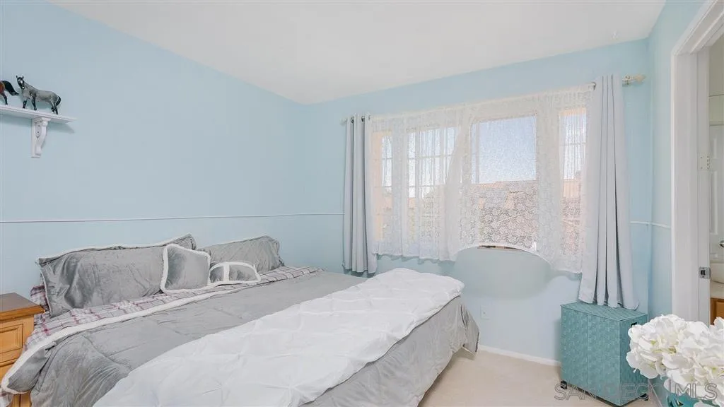 769 Avenida Codorniz San Marcos, CA 92069 - Photo 21 of 25 a bedroom with a bed and window