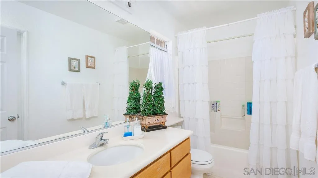 769 Avenida Codorniz San Marcos, CA 92069 - Photo 22 of 25 a bathroom with a sink toilet and shower