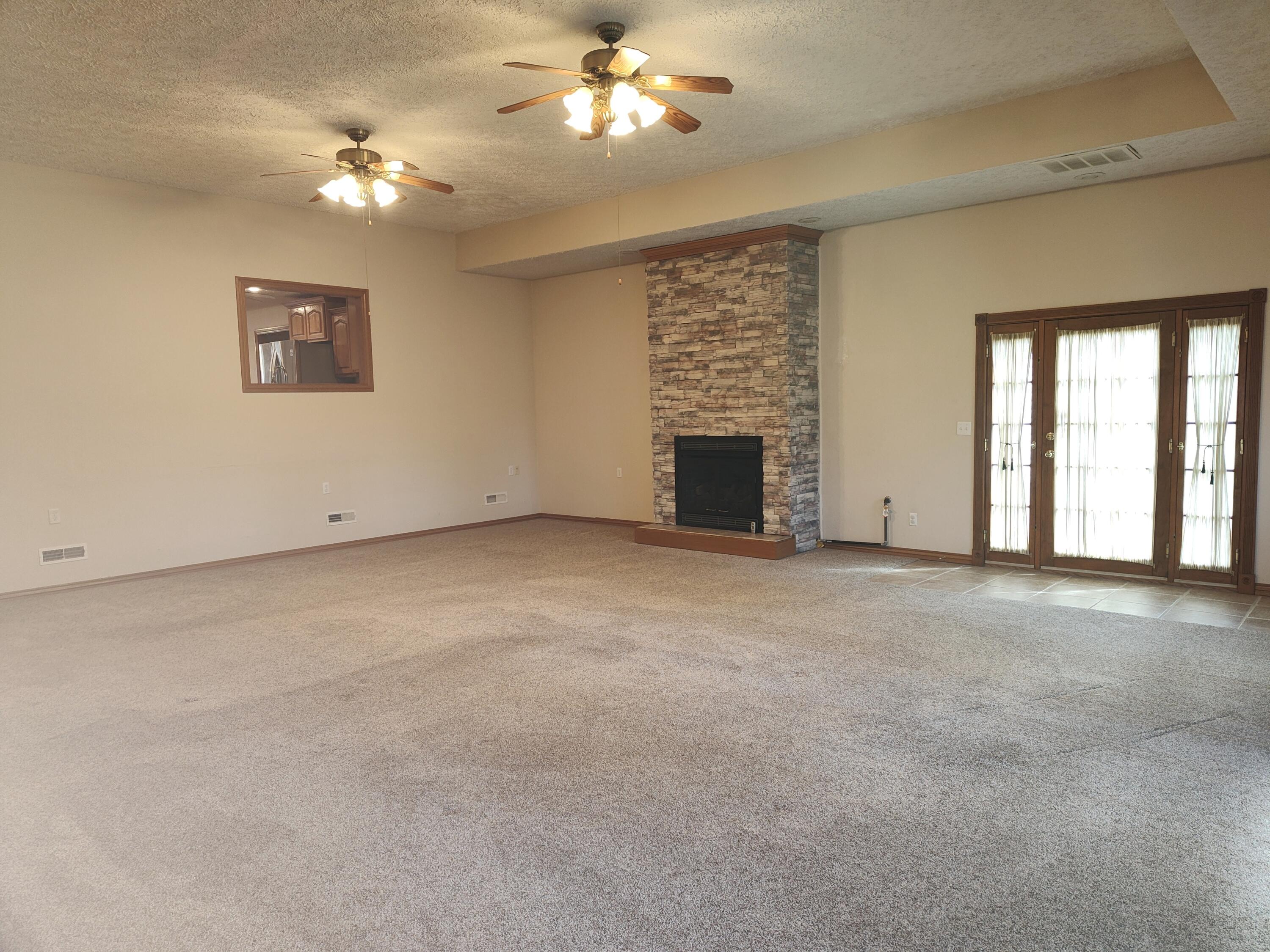 4107 South 118th Road Bolivar, MO 65613 - Photo 20 of 48 Great room with doors to patio
