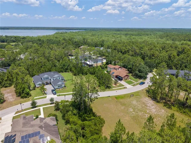 a view of a lake with a yard