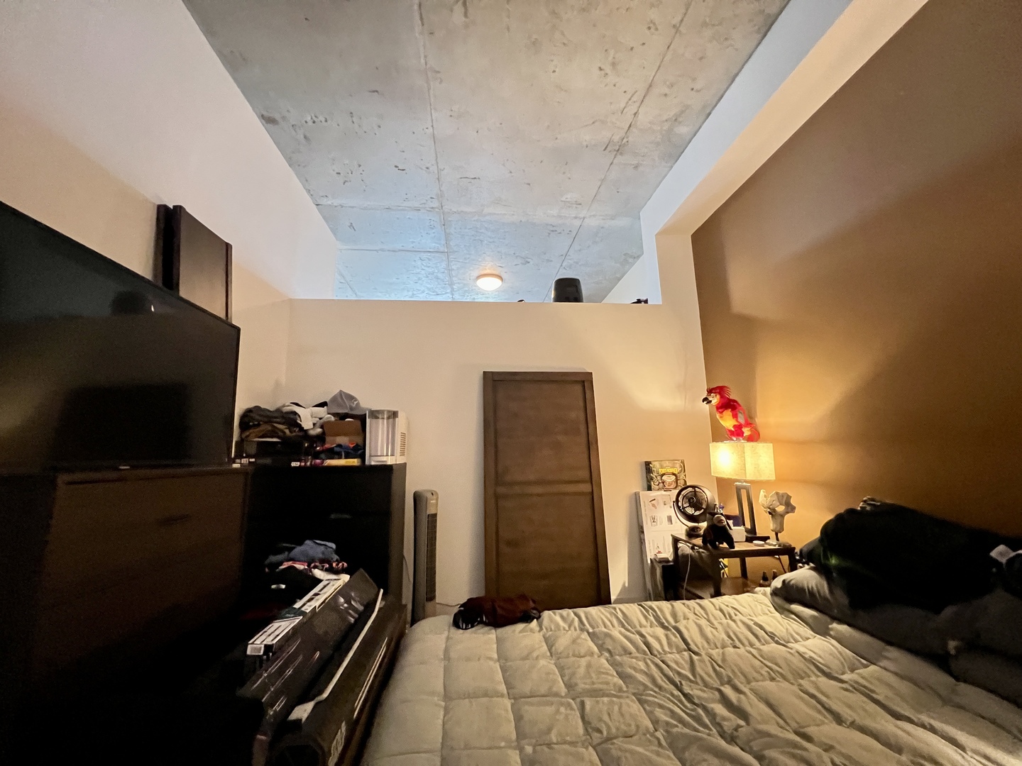 235 West Van Buren Street, Unit 3310 Chicago, IL 60607 - Photo 11 of 18 a bedroom with a bed and a flat screen tv