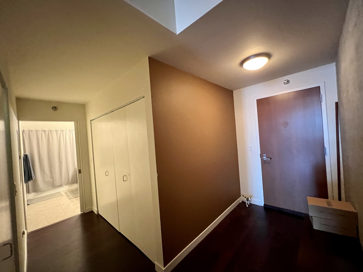 235 West Van Buren Street, Unit 3310 Chicago, IL 60607 - Photo 12 of 18 an empty room with wooden floor and windows