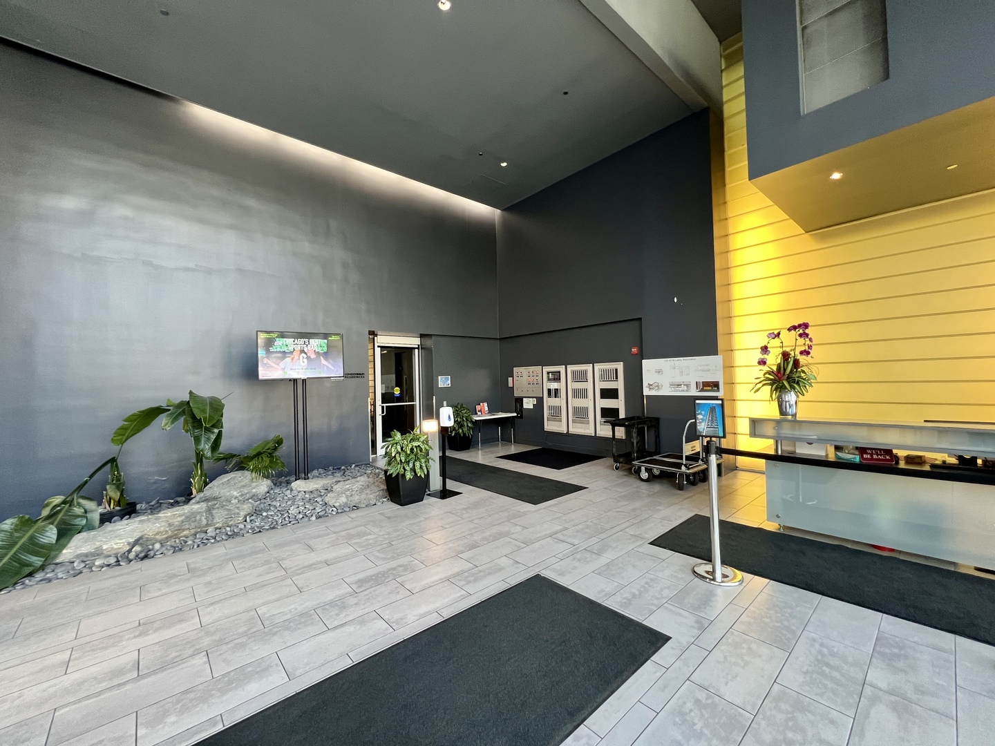 235 West Van Buren Street, Unit 3310 Chicago, IL 60607 - Photo 2 of 18 a view of a lobby with chair and tables