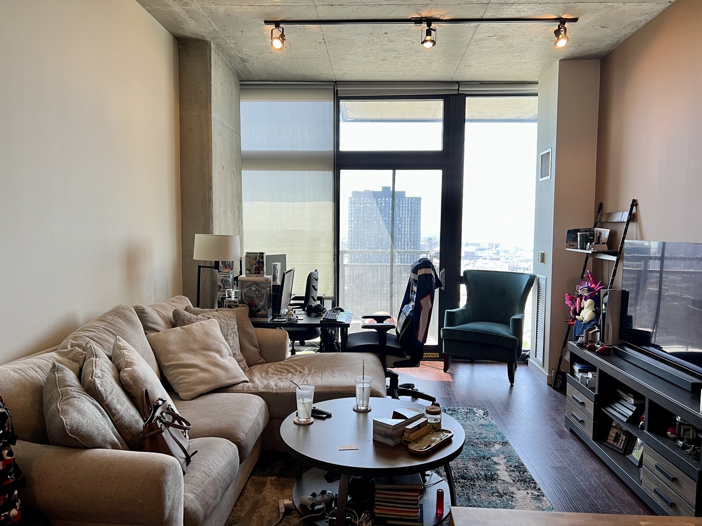 235 West Van Buren Street, Unit 3310 Chicago, IL 60607 - Photo 9 of 18 a living room with furniture and a floor to ceiling window