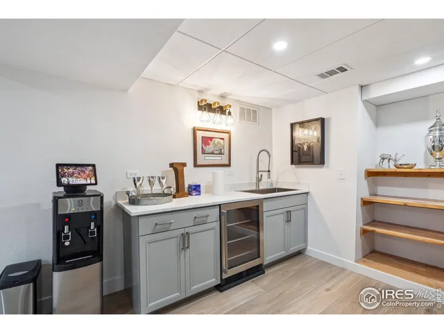 a kitchen with a sink cabinets and window