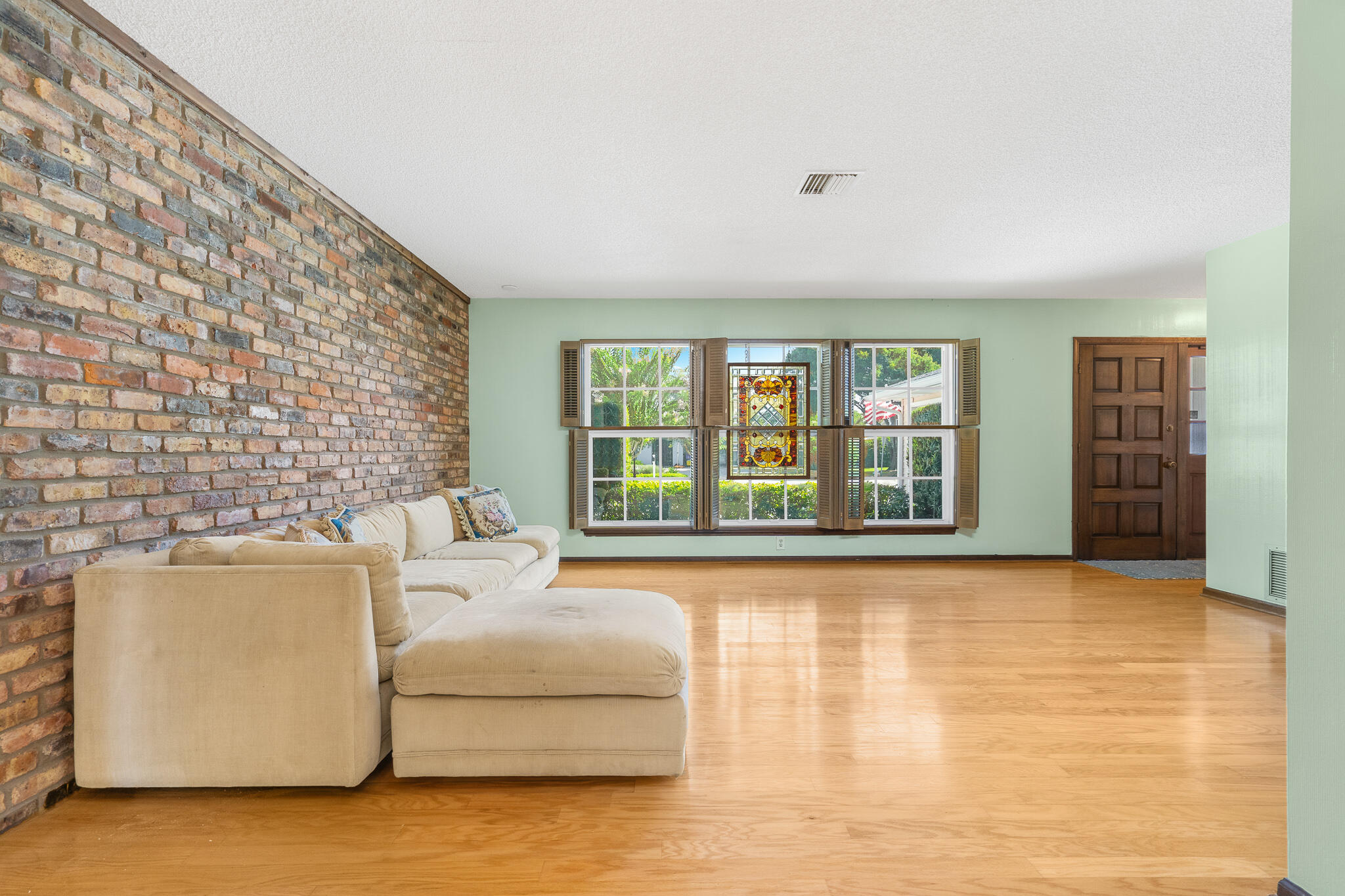 8 Northwest 24th Street Delray Beach, FL 33444 - Photo 19 of 29 a living room with furniture and a flat screen tv