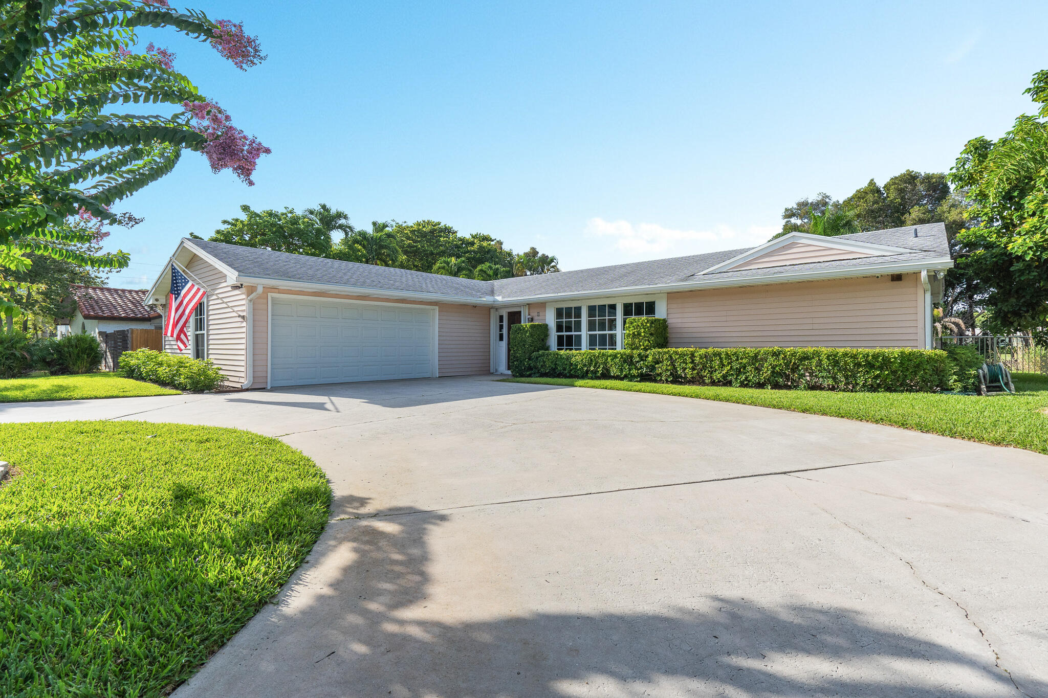 8 Northwest 24th Street Delray Beach, FL 33444 - Photo 2 of 29 a front view of house with yard and green space