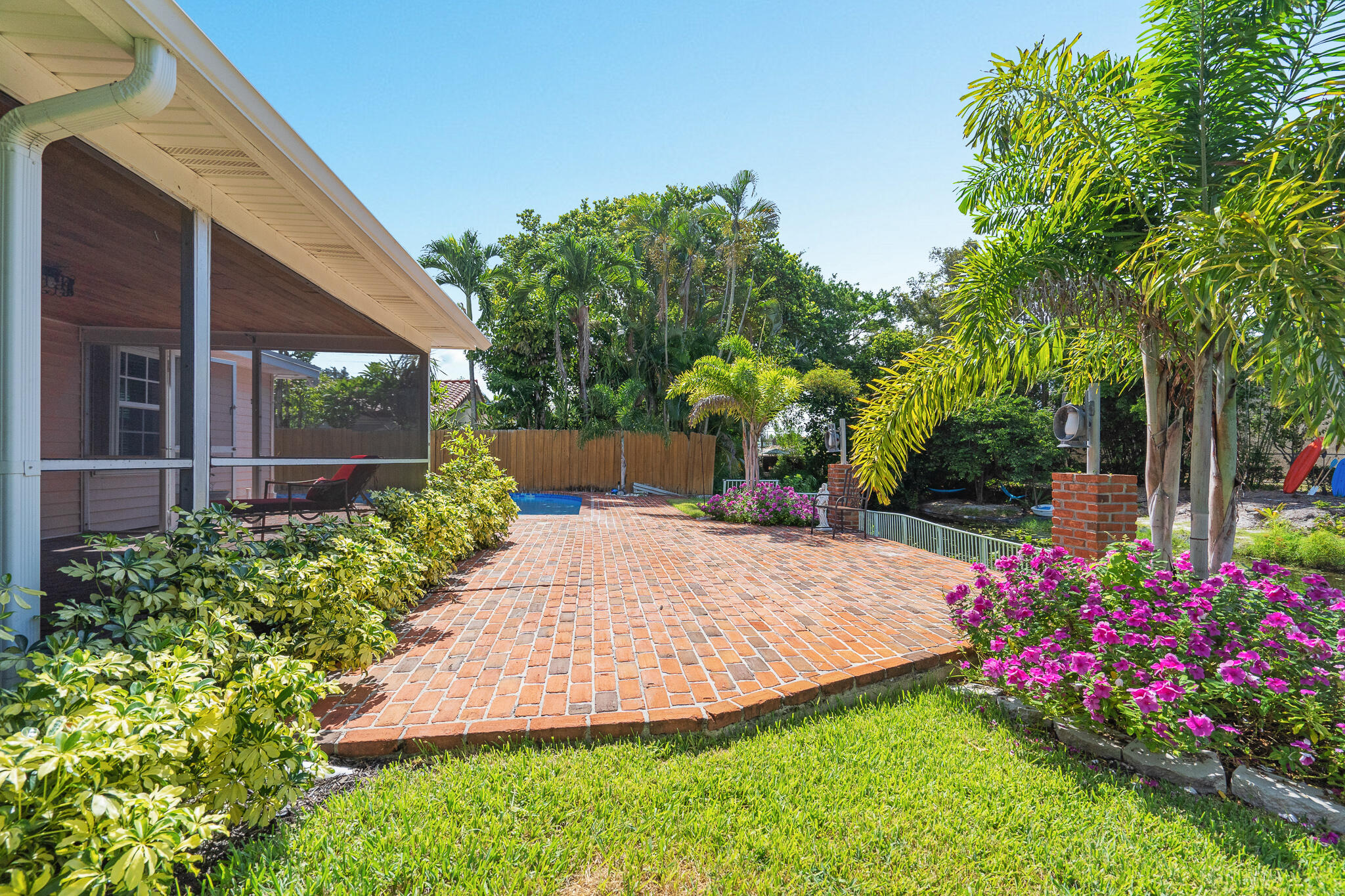 8 Northwest 24th Street Delray Beach, FL 33444 - Photo 28 of 29 a view of a backyard with potted plants and large tree