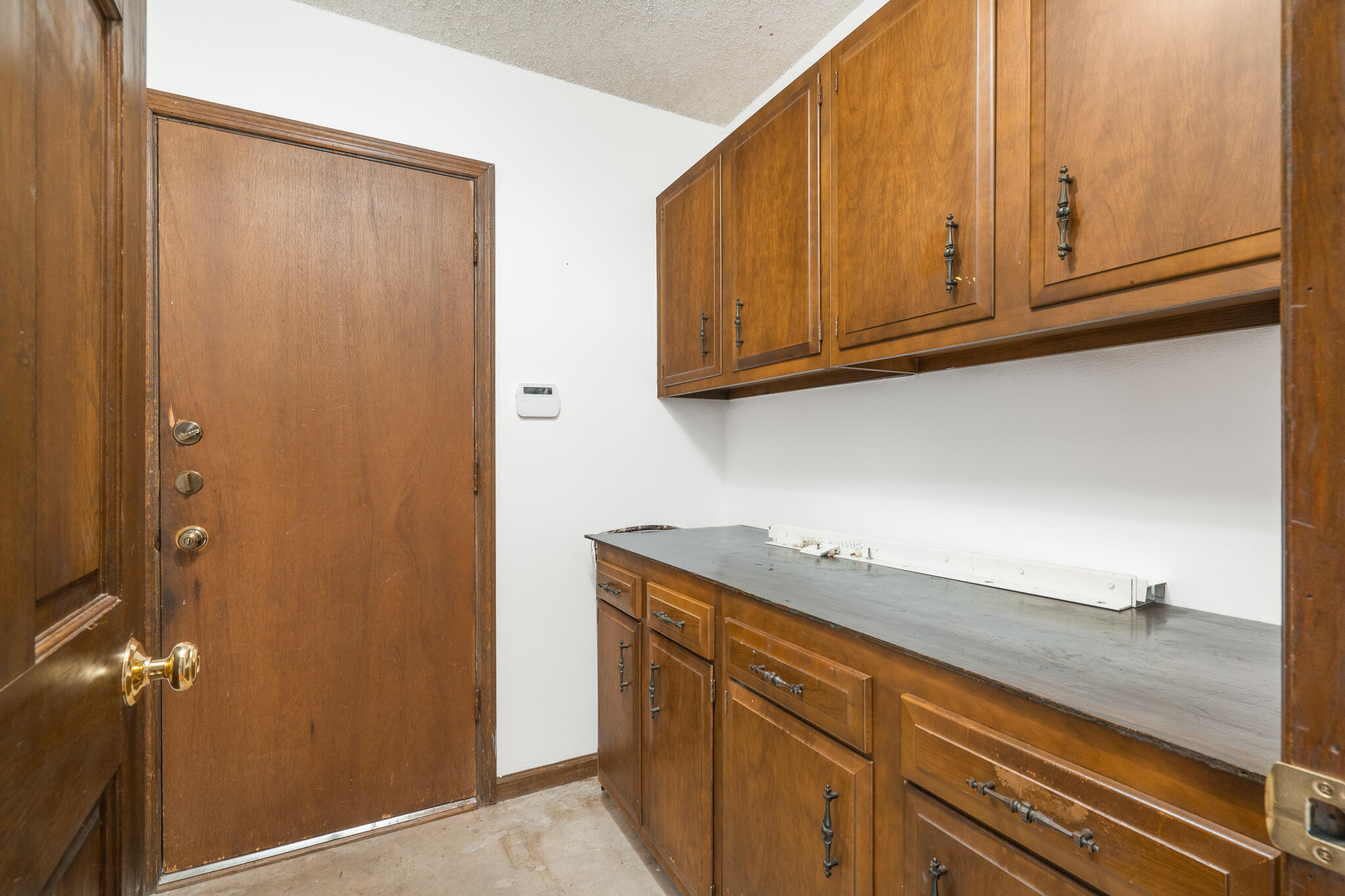 8 Northwest 24th Street Delray Beach, FL 33444 - Photo 7 of 29 a utility room with granite countertop cabinets and sink