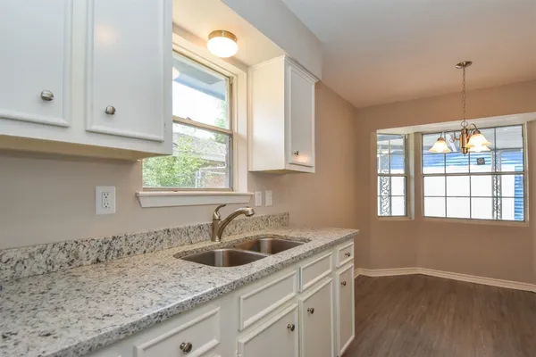 a kitchen that has a sink and a window