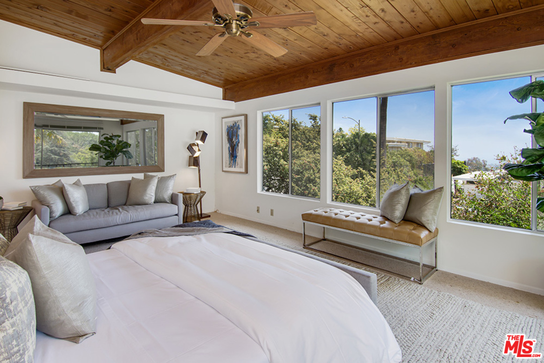 1071 Tellem Drive Pacific Palisades, CA 90272 - Photo 12 of 26 a living room with furniture and a large window