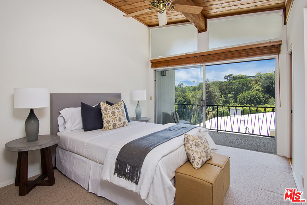 1071 Tellem Drive Pacific Palisades, CA 90272 - Photo 16 of 26 a bedroom with a bed and a night stand